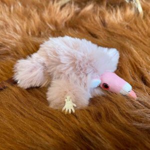Cute light pink mouse plushie with tongue